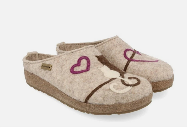 wool slippers with cats and paw on natural background. classic wool slipper